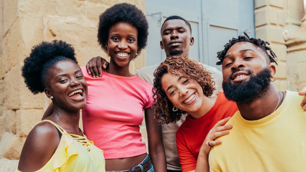 A group of young adults smiling together