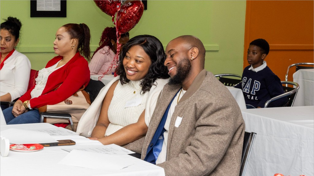 A couple smiling together at a TIA family event.