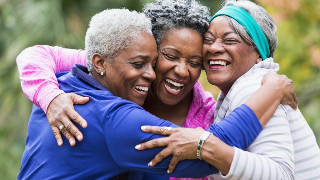 Three women embracing and laughing together